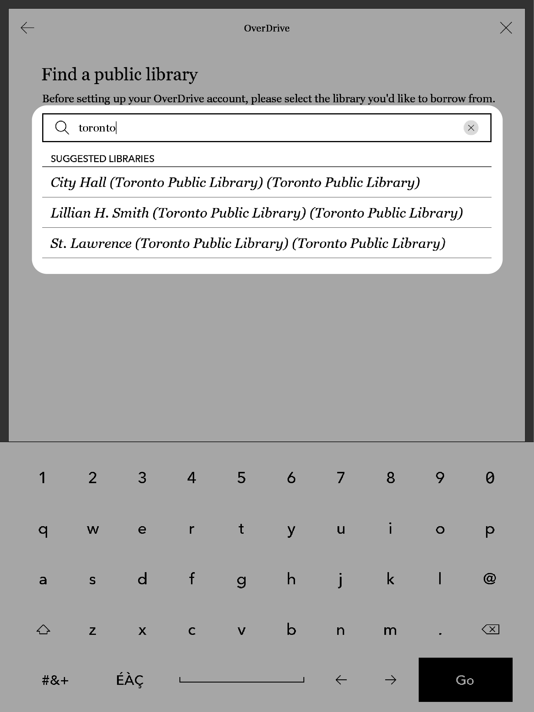 Menu OverDrive d'une liseuse Kobo avec le champ de recherche de bibliothèque mis en évidence.